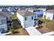 Two-story house with attached garage, viewed from above in a residential neighborhood at 17033 Oval Rum Dr, Wimauma, FL 33598