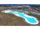 Aerial view of a crystal lagoon water park at 17033 Oval Rum Dr, Wimauma, FL 33598