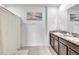 Double vanity bathroom with granite countertops at 17033 Oval Rum Dr, Wimauma, FL 33598