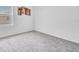 Spacious bedroom with gray carpet and large window at 17033 Oval Rum Dr, Wimauma, FL 33598