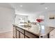 Kitchen with granite countertops and dark wood cabinets at 17033 Oval Rum Dr, Wimauma, FL 33598