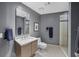 Modern bathroom with gray walls, white vanity, and glass shower at 175 1St S St # 3102, St Petersburg, FL 33701