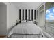 Bedroom with black and white striped wall and water views at 175 1St S St # 3102, St Petersburg, FL 33701