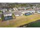 Aerial view of houses with pools and fenced backyards at 18442 New London Ave, Land O Lakes, FL 34638