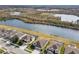 Aerial view of houses on lakefront community at 18442 New London Ave, Land O Lakes, FL 34638