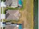 Aerial view of house and backyard on lake at 18442 New London Ave, Land O Lakes, FL 34638