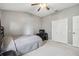 Spacious bedroom with large closet and ceiling fan at 18442 New London Ave, Land O Lakes, FL 34638