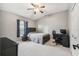 Bright bedroom with a full-size bed and workspace at 18442 New London Ave, Land O Lakes, FL 34638