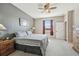 King-size bed in a spacious bedroom with water views at 18442 New London Ave, Land O Lakes, FL 34638