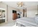 Main bedroom with a dresser, TV and en-suite bathroom access at 18442 New London Ave, Land O Lakes, FL 34638