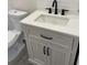 Modern bathroom vanity with white countertop and black hardware at 1916 Seminole S Blvd, St Petersburg, FL 33705