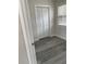 Simple bedroom with gray vinyl plank flooring and a closet at 1916 Seminole S Blvd, St Petersburg, FL 33705