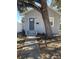 Charming bungalow with gray exterior, walkway, and mature tree at 1916 Seminole S Blvd, St Petersburg, FL 33705