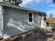 Gray house exterior with a white trim, windows and a door at 1916 Seminole S Blvd, St Petersburg, FL 33705