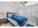 Guest bedroom with a full-size bed and ceiling fan at 19727 Gulf Blvd # C-1, Indian Shores, FL 33785