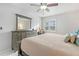 Spacious bedroom with dresser, large bed, and window at 19727 Gulf Blvd # C-1, Indian Shores, FL 33785