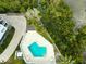 Community pool with lounge chairs and lush landscaping at 19727 Gulf Blvd # 103, Indian Shores, FL 33785