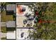 Aerial view of the home's roofline and surrounding trees at 204 Sky Loch W Dr, Dunedin, FL 34698