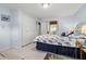 Bright bedroom with double bed and built-in closet at 204 Sky Loch W Dr, Dunedin, FL 34698