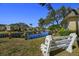 Peaceful waterfront community with canal views and a bench at 204 Sky Loch W Dr, Dunedin, FL 34698