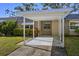 Covered carport with walkway to front door at 204 Sky Loch W Dr, Dunedin, FL 34698