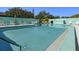 Refreshing community pool with plenty of lounge chairs at 204 Sky Loch W Dr, Dunedin, FL 34698