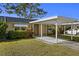 Florida home with carport and nicely landscaped lawn at 204 Sky Loch W Dr, Dunedin, FL 34698