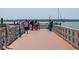 Fishing pier with people and boats in the background at 204 Sky Loch W Dr, Dunedin, FL 34698