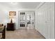 Hallway with view into bedroom and access to closets at 204 Sky Loch W Dr, Dunedin, FL 34698