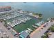 Aerial view of marina with many boats and parking at 204 Sky Loch W Dr, Dunedin, FL 34698