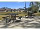 Enjoyable outdoor picnic area with tables and canal views at 204 Sky Loch W Dr, Dunedin, FL 34698