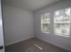 Well-lit bedroom with two windows and carpet at 2109 1St N Ave, St Petersburg, FL 33713