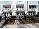 Townhouses with front patios, landscaping, and black fences at 2109 1St N Ave, St Petersburg, FL 33713