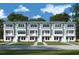 Modern 3-story townhouses with balconies and a landscaped lawn at 2109 1St N Ave, St Petersburg, FL 33713