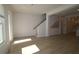 Bright living room with hardwood floors and staircase at 2109 1St N Ave, St Petersburg, FL 33713