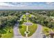 Aerial view of community with lush landscaping and fountain at 2222 Americus N Blvd # 2, Clearwater, FL 33763