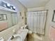 Bright bathroom featuring a shower/tub, vanity, and updated fixtures at 2222 Americus N Blvd # 2, Clearwater, FL 33763