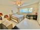 Bedroom with a queen bed and home office at 2222 Americus N Blvd # 2, Clearwater, FL 33763