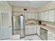 Updated kitchen with stainless steel appliances and white cabinets at 2222 Americus N Blvd # 2, Clearwater, FL 33763