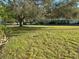 Large grassy yard with mature shade trees at 2222 Americus N Blvd # 2, Clearwater, FL 33763