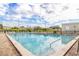 Community swimming pool with lounge chairs at 2222 Americus N Blvd # 2, Clearwater, FL 33763