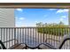 Balcony view overlooking the water and palm trees at 2506 N Rocky Point Dr # 272, Tampa, FL 33607