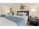 Bedroom with a full bed, nightstand and mirrored closet at 2506 N Rocky Point Dr # 272, Tampa, FL 33607