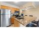 Modern kitchen with stainless steel appliances and granite countertops at 2506 N Rocky Point Dr # 272, Tampa, FL 33607