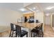 Kitchen with granite countertops and breakfast bar at 2506 N Rocky Point Dr # 272, Tampa, FL 33607