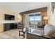 Living room with balcony access and water view at 2506 N Rocky Point Dr # 272, Tampa, FL 33607