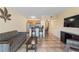 Living room features kitchen, tile floors and TV at 2506 N Rocky Point Dr # 272, Tampa, FL 33607