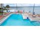 Relaxing pool area with water and lounge chairs at 2506 N Rocky Point Dr # 272, Tampa, FL 33607