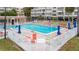 Resort-style pool with surrounding lounge chairs at 2506 N Rocky Point Dr # 272, Tampa, FL 33607