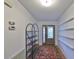 Bright entryway with built-in shelving, terracotta tile flooring, and an oriental rug at 2510 Lambdin Dr, Sun City Center, FL 33573